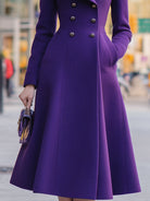 Purple Agnes Lumina Vancouver double-breasted shawl collar flared midi coat on a model, showcasing stylish winter outerwear.
