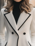 Lumina Vancouver Freya double-breasted white coat with black trim, stylish and tailored for a sophisticated look.