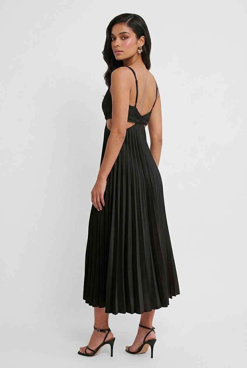 Elegant black pleated dress from Lumina Wear with a flattering silhouette, showcased on a mannequin.