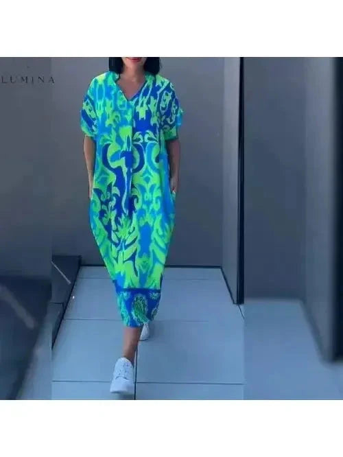 Blue Terttu elegant dress by Lumina Vancouver featuring a fitted silhouette and stylish design for formal occasions.
