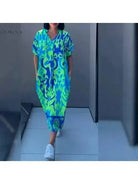 Blue Terttu elegant dress by Lumina Vancouver featuring a fitted silhouette and stylish design for formal occasions.