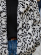 White Doris faux fur jacket by Lumina Vancouver, shown on a model, featuring plush fur and stylish design.