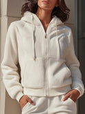 Lumina Wear Ida hooded jacket with zip front and fleece panels in white, shown in XS size, casual outdoor jacket for women