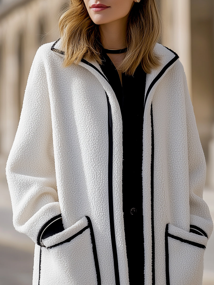 Longline Harlow wool-blend coat with contrast piping in white, designed by Lumina Vancouver, showcases a stylish, tailored silhouette.