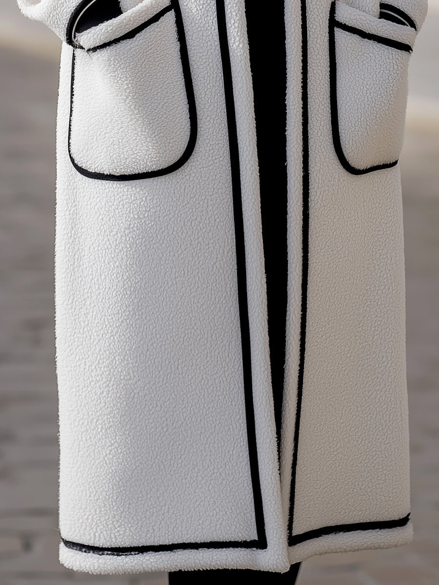 Longline Harlow wool-blend coat with contrast piping in white, designed by Lumina Vancouver, featuring a tailored fit and classic style.