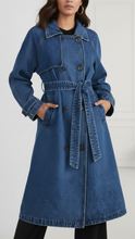 Blue Elena longline denim trench coat with belt from Lumina Wear, shown on a model, featuring classic design and tailored fit.