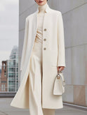 White Ottilie longline wool coat by Lumina Wear, shown on a model, featuring a tailored fit and stylish design.