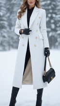 Lumina Wear Elena Luxe double-breasted longline coat with peak lapels in white, featuring a tailored fit and elegant style.
