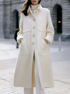 White oversized pocket coat by Lumina Vancouver, featuring a relaxed fit and stylish design, worn by Elena.
