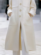 White Estelle oversized pocket coat by Lumina Vancouver, featuring a relaxed fit and large front pockets.