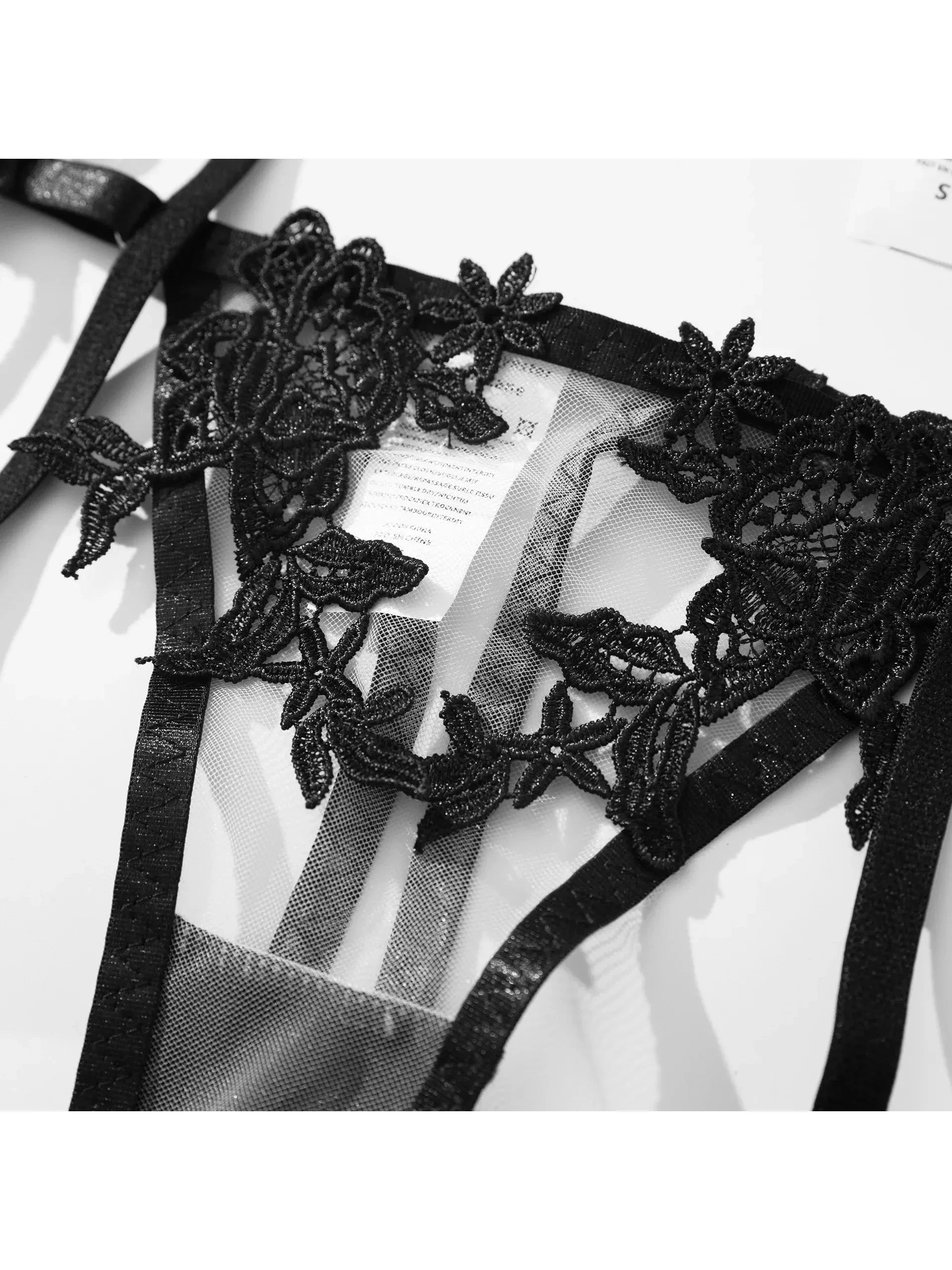 Black Impi Lingerie Set by Lumina Vancouver featuring a delicate lace bra and matching panties on a neutral background.