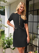 Black Toini short-sleeve A-line mini dress by Lumina Vancouver displayed on a model.