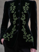 Black Bettina blazer by Lumina Wear featuring a tailored fit, high neck, and velvet embroidery detail.