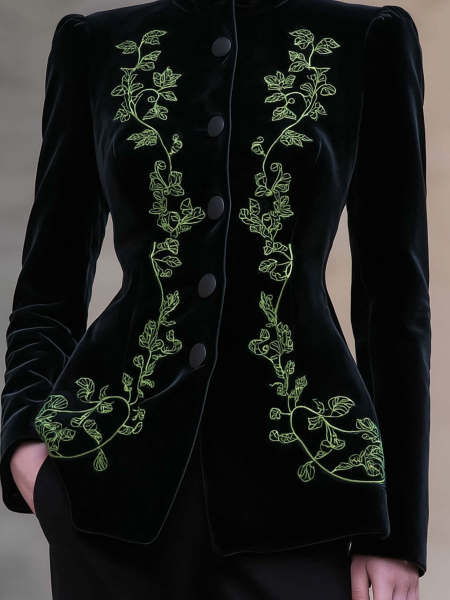 Black Bettina blazer by Lumina Wear featuring a tailored fit, high neck, and velvet embroidery detail.