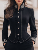Black Lumina Wear blazer with tailored fit and ornate embroidery, featuring detailed embroidery on the front and sleeves.