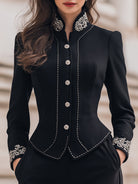 Black Lumina Wear blazer with tailored fit and ornate embroidery, featuring detailed embroidery on the front and sleeves.