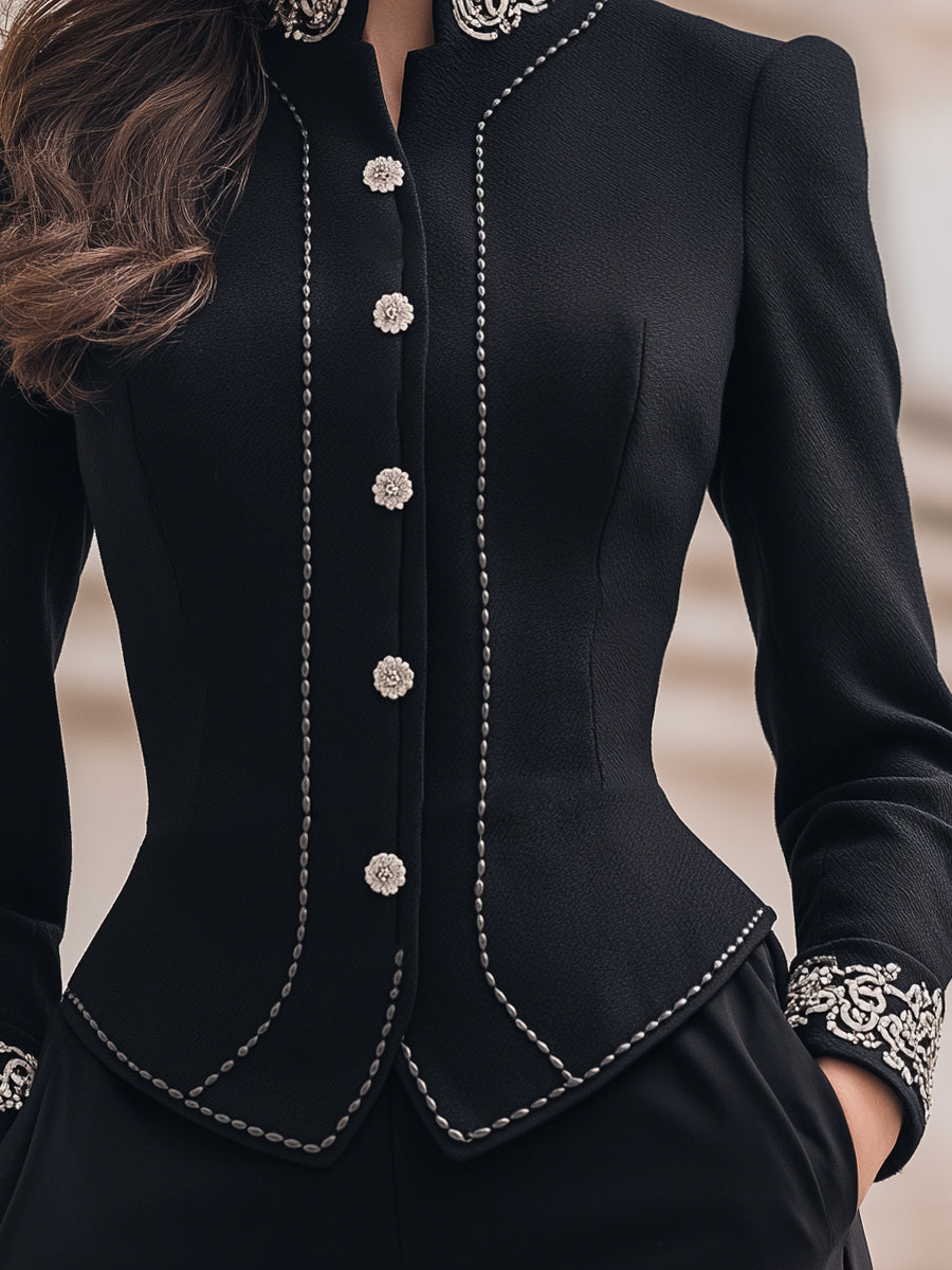Black tailored blazer with ornate embroidery by Lumina Wear, featuring detailed embroidery on the front, worn by Elena.