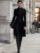 Black Hazel Lumina Vancouver tailored zip-up coat on a model, showcasing a fitted design and stylish collar detail.