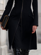 Black Hazel tailored zip-up coat by Lumina Vancouver, shown on a model with front zipper and sleek design.