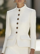 White Elena textured blazer with stand collar and gold buttons from Lumina Vancouver, shown on a mannequin.