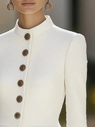 White Elena textured blazer with stand collar and gold buttons by Lumina Vancouver, shown on a model.