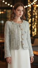Light blue Elena Tweed Jacket with contrast trim by Lumina Wear, shown on a model, featuring tailored fit and textured fabric.