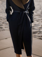Black Lumina Vancouver Greer wool coat with oversized fur collar, shown on a model, stylish and warm winter outerwear.