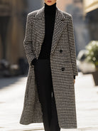 Black Marion Lumina Vancouver houndstooth wool long coat displayed on a model, showcasing its tailored fit and classic pattern.