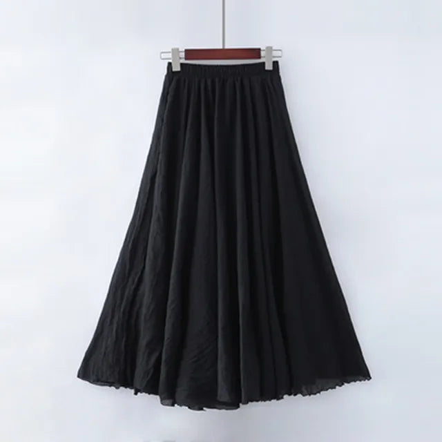 Elegant beige maxi skirt by Lumina Wear featuring a high waist and flowing design, shown on a black mannequin.