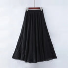 Elegant beige maxi skirt by Lumina Wear featuring a high waist and flowing design, shown on a black mannequin.