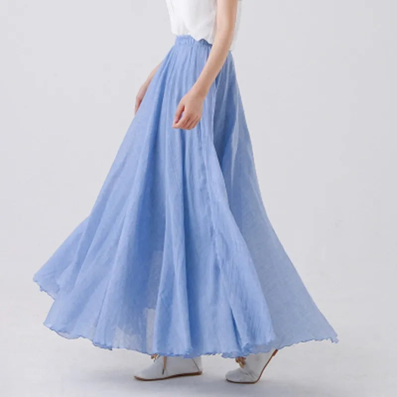 Elegant beige maxi skirt with high waist from Lumina Wear, styled on a model, showcasing flowy fabric and sophisticated design.