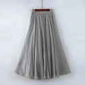 Beige Elianne maxi skirt by Lumina Wear featuring a high waist and elegant flowing design on a model.
