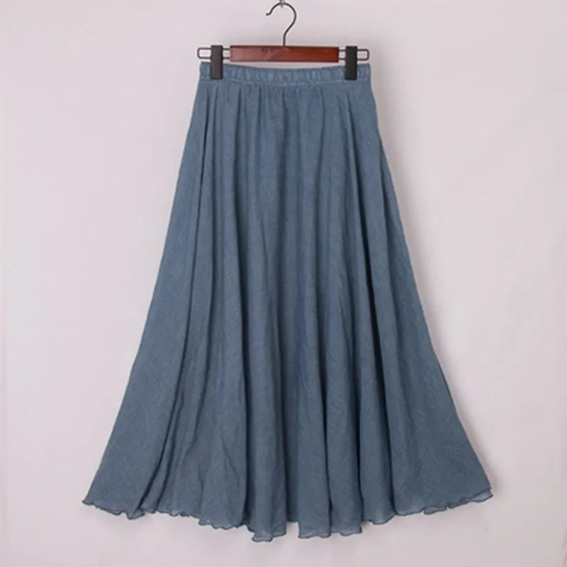 Elegant beige Elianne maxi skirt with high waist from Lumina Wear, shown on a black background, one size fits most.