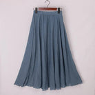 Elegant beige Elianne maxi skirt with high waist from Lumina Wear, shown on a black background, one size fits most.