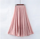 Elegant beige maxi skirt with high waist from Lumina Wear, shown in a flowing style and comfortable fit.