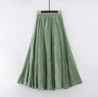 Elegant beige maxi skirt with high waist by Lumina Wear, showcased flowing in a natural pose.