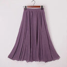 Elegant beige high-waist maxi skirt from Lumina Wear, flowing fabric with a stylish, sophisticated silhouette.