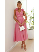 Pink Severine elegant summer dress by Lumina Vancouver, perfect for wedding guests, with flowing fabric and stylish design.