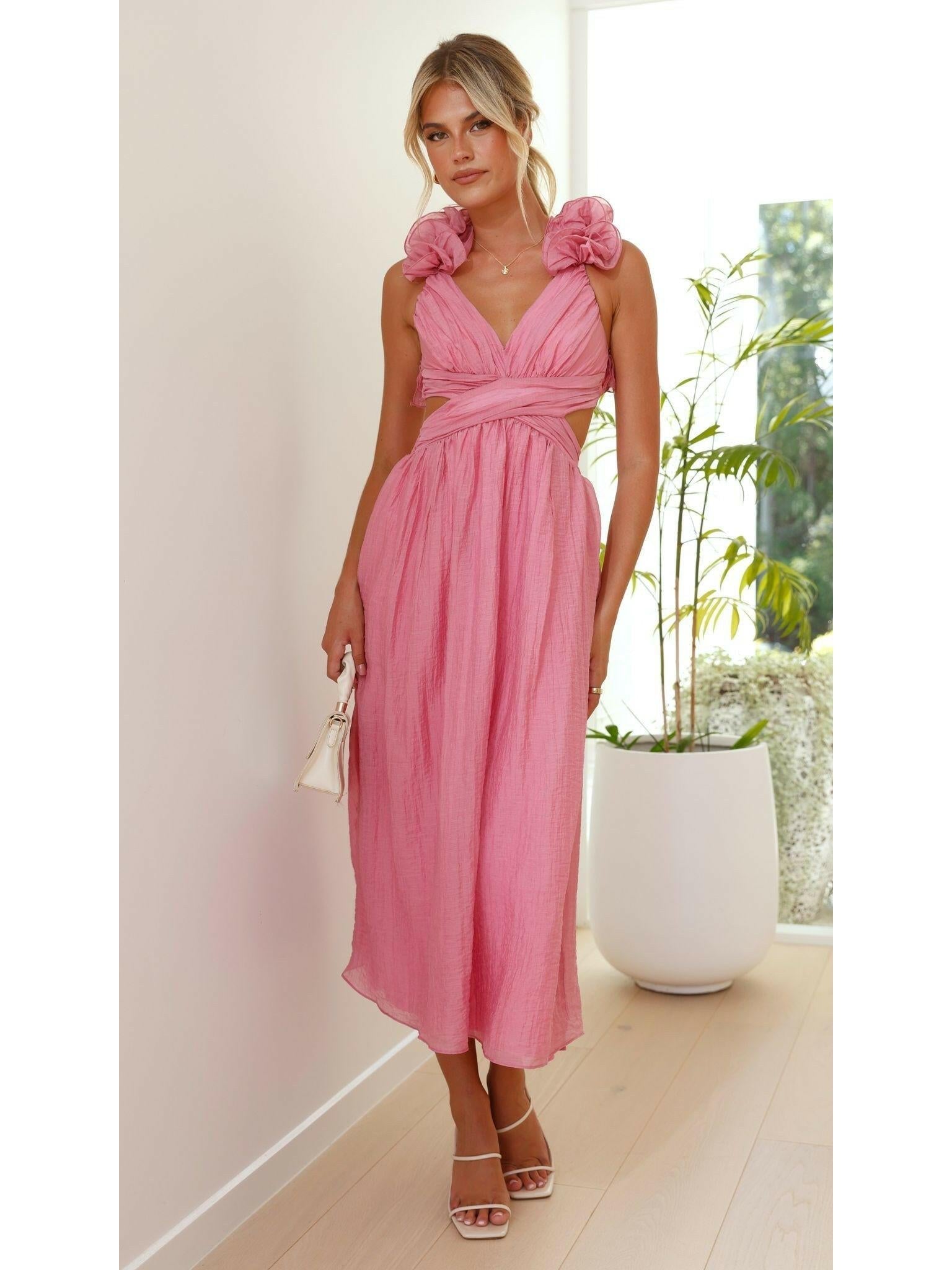 Pink Severine elegant summer dress by Lumina Wear, featuring flowing fabric perfect for wedding guest or warm-weather occasions.