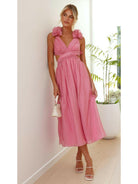 Pink Severine elegant summer wedding guest dress by Lumina Vancouver, featuring a flowy design and sleeveless style.