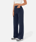 Elsa Lumina Wear high-waist black trousers with pockets, comfortable fit, tailored for a stylish, casual look.