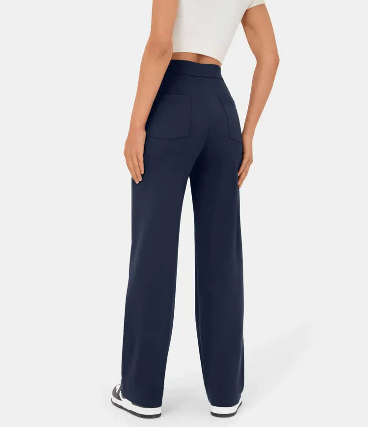 Elsa black high-waist trousers with pockets from Lumina Wear, featuring a comfortable fit and sleek dark blue fabric.