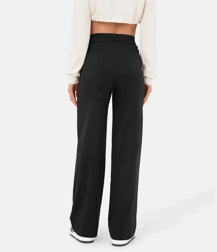 Elsa Lumina Wear high-waist black trousers with pockets, comfortable fit, stylish for casual or professional wear.