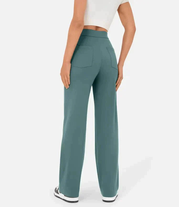 Elsa Lumina Wear high-waist black trousers with pockets, featuring a comfortable fit and stylish design, shown in the image.