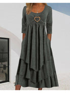 Gray Elsa Heart Detail Tiered Dress by Lumina Vancouver, featuring a feminine silhouette and decorative heart accents.