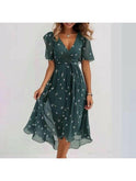 Blue Elvira printed summer dress by Lumina Wear featuring a flowy design and vibrant floral pattern, perfect for warm weather.