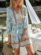 Sky blue Katariina boho dress by Lumina Vancouver, featuring flowy fabric and bohemian style, displayed on a hanger.