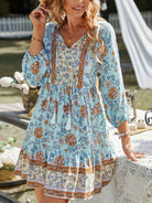 Sky blue Katariina boho dress by Lumina Vancouver, featuring flowy fabric and bohemian style, displayed on a hanger.