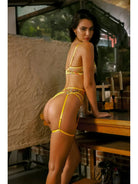Yellow floral lingerie set by Lumina Vancouver featuring delicate lace and satin details on a model.