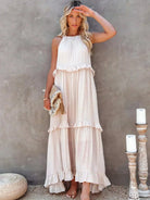 Laila Lumina Vancouver halter ruffle maxi dress in apricot, flowing design with ruffle details, perfect for summer occasions.